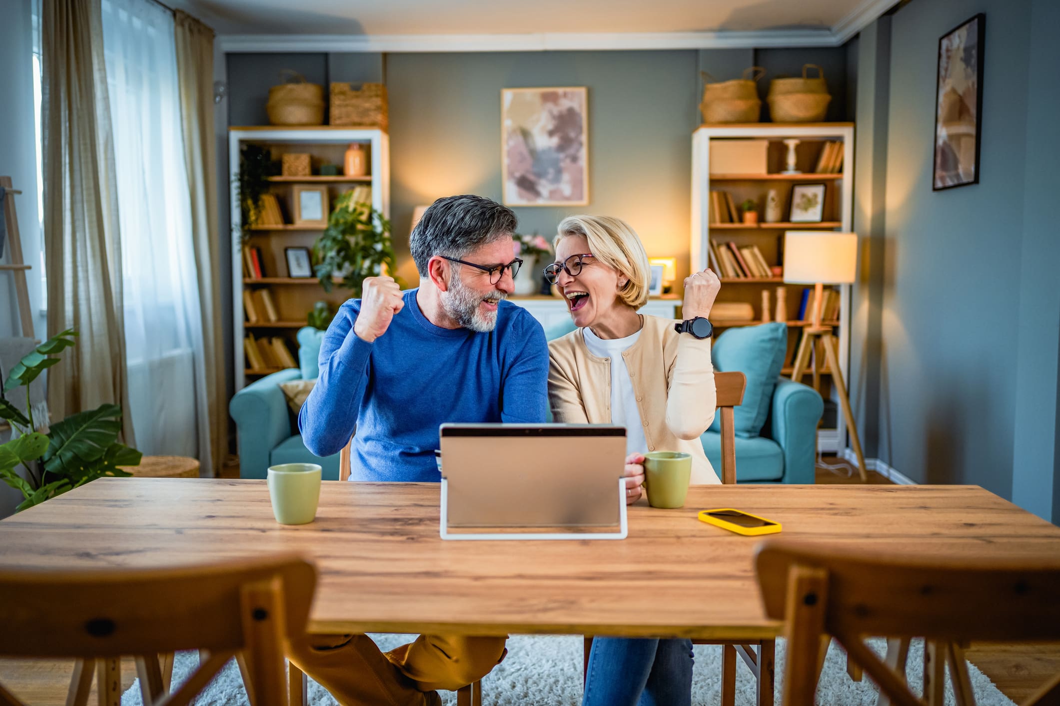 Excited mature couple at home
